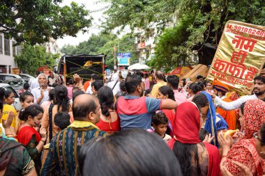 New Delhi, India July 01 2022 - A huge gathering of devotees from different parts of Delhi on the occasion of ratha yatra or rathyatra. Rath for Lord Jagannath pulled by people, Jagannath Rath Yatra