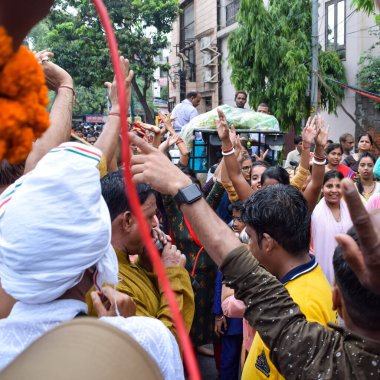 New Delhi, India July 01 2022 - A huge gathering of devotees from different parts of Delhi on the occasion of ratha yatra or rathyatra. Rath for Lord Jagannath pulled by people, Jagannath Rath Yatra