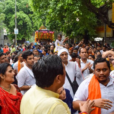New Delhi, India July 01 2022 - A huge gathering of devotees from different parts of Delhi on the occasion of ratha yatra or rathyatra. Rath for Lord Jagannath pulled by people, Jagannath Rath Yatra