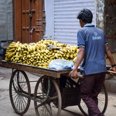Old Delhi, India, April 15, 2022 - Unidentified group of men walking the streets of Old Delhi, Street Photography of Chandni Chowk market of Old Delhi during morning time, Old Delhi Street Photography