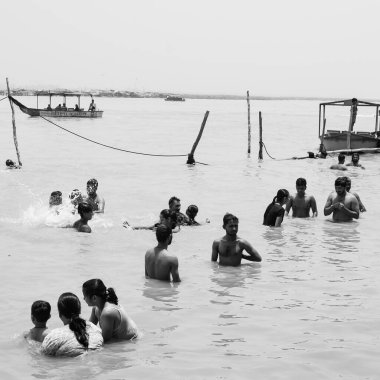 Garh Mukteshwar, UP, India, June 11 2022 -People are taking holy dip on the occasion of Nirjala Ekadashi, A view of Garh Ganga Brij ghat which is very famous religious place for Hindus-Black and White
