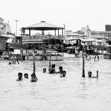 Garh Mukteshwar, UP, India, June 11 2022 -People are taking holy dip on the occasion of Nirjala Ekadashi, A view of Garh Ganga Brij ghat which is very famous religious place for Hindus-Black and White