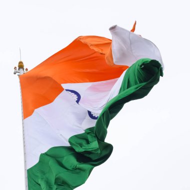 India flag flying high at Connaught Place with pride in blue sky, India flag fluttering, Indian Flag on Independence Day and Republic Day of India, tilt up shot, Waving Indian flag, Har Ghar Tiranga