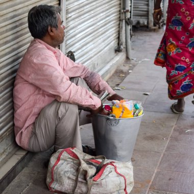 Old Delhi, India, April 15, 2022 - Unidentified group of men walking the streets of Old Delhi, Street Photography of Chandni Chowk market of Old Delhi during morning time, Old Delhi Street Photography