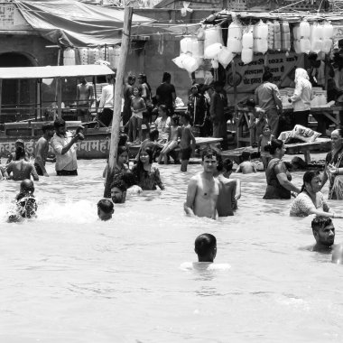 Garh Mukteshwar, UP, India, June 11 2022 -People are taking holy dip on the occasion of Nirjala Ekadashi, A view of Garh Ganga Brij ghat which is very famous religious place for Hindus-Black and White