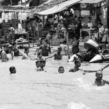 Garh Mukteshwar, UP, India, June 11 2022 -People are taking holy dip on the occasion of Nirjala Ekadashi, A view of Garh Ganga Brij ghat which is very famous religious place for Hindus-Black and White