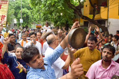 New Delhi, India July 01 2022 - A huge gathering of devotees from different parts of Delhi on the occasion of ratha yatra or rathyatra. Rath for Lord Jagannath pulled by people, Jagannath Rath Yatra