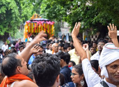 New Delhi, India July 01 2022 - A huge gathering of devotees from different parts of Delhi on the occasion of ratha yatra or rathyatra. Rath for Lord Jagannath pulled by people, Jagannath Rath Yatra