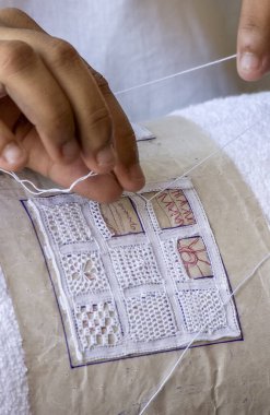 Handmade brazilian renaissance lace. Craftsman hands in close-up. Brazilian handicraft.