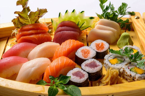 Japanese food mix including sushi and sashimi on wooden barge. — Stock Image Japanese Food Mix Including Sushi Sashimi Wooden Barge Royalty Free Stock Photos