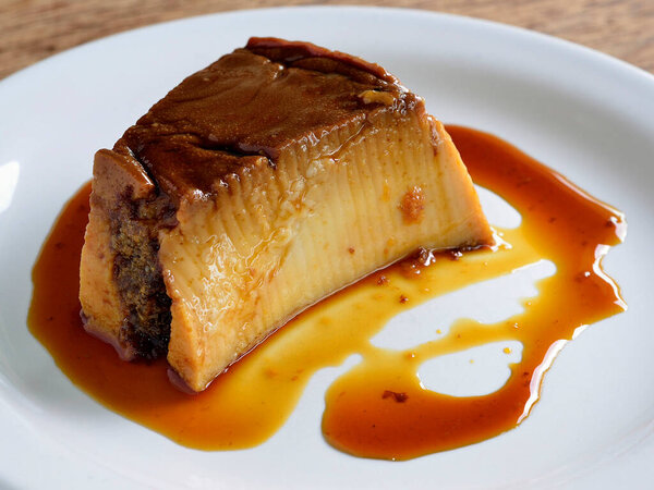 Milk pudding in white dish. Brazilian dessert. — Stock Image Milk Pudding White Dish Brazilian Dessert Royalty Free Stock Images
