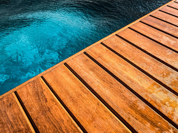 Wooden deck by the pool in close up for background. — Stock Image Wooden Deck Pool Close Background Stock Picture