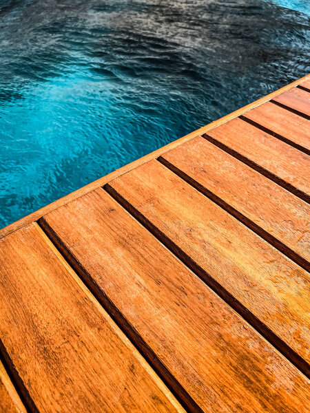 Wooden deck by the pool in close up for background. — Stock Image Wooden Deck Pool Close Background Stock Photo