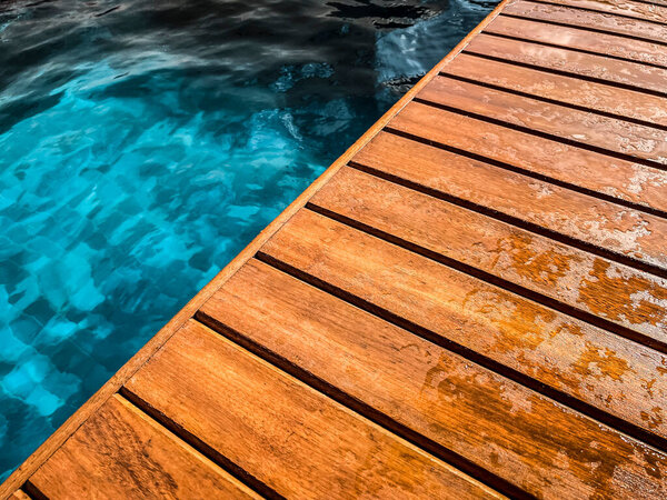 Wooden deck by the pool in close up for background. — Stock Image Wooden Deck Pool Close Background Stock Photo