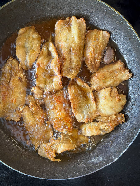 Fish being fried in a pan with oil. Fried food. — Stock Image Fish Being Fried Pan Oil Fried Food Stock Image