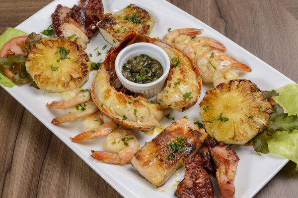 Seafood. Lobster, shrimp, octopus and fish in white bowl on wooden table. Brazilian food. — Stock Image Seafood Lobster Shrimp Octopus Fish White Bowl Wooden Table Brazilian Stock Photo