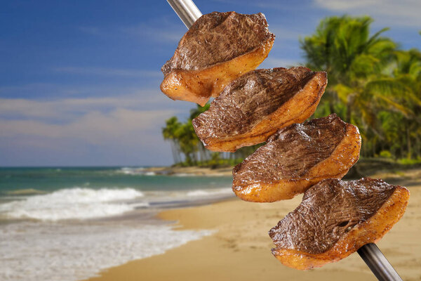Barbecue picanha grilled on skewers with Brazilian beach scene in the background. — Stock Image Barbecue Picanha Grilled Skewers Brazilian Beach Scene Background Royalty Free Stock Images