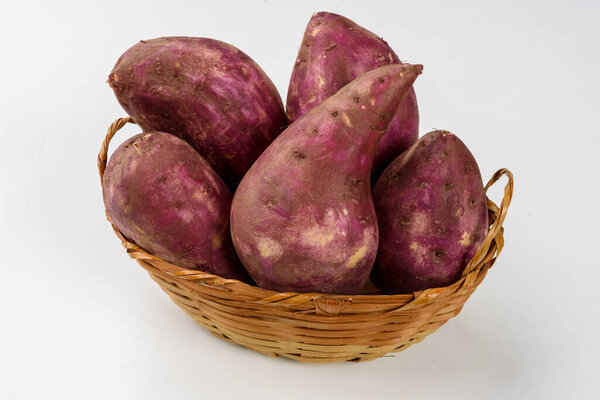 Sweet potatoes in a basket isolated on white background. — Stock Image Sweet Potatoes Basket Isolated White Background Royalty Free Stock Photos