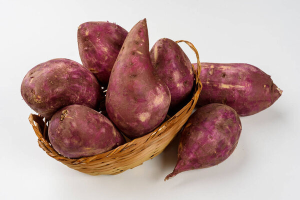 Sweet potatoes in a basket isolated on white background. — Stock Image Sweet Potatoes Basket Isolated White Background Royalty Free Stock Photos