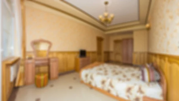 Master bedroom with wood bed and water view for background Abstract blur and defocused apartment, condominium, hotel, commercial building.