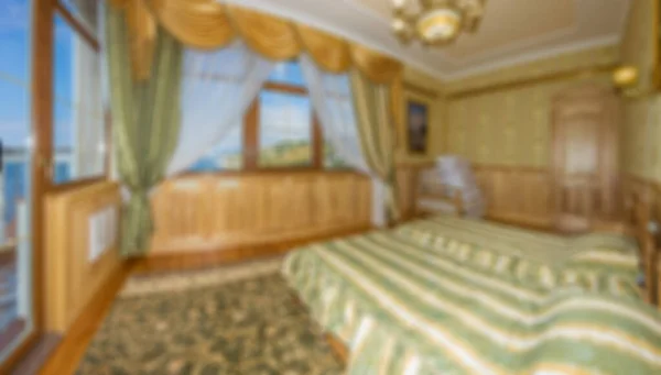 Master bedroom with wood bed and water view for background Abstract blur and defocused apartment, condominium, hotel, commercial building.