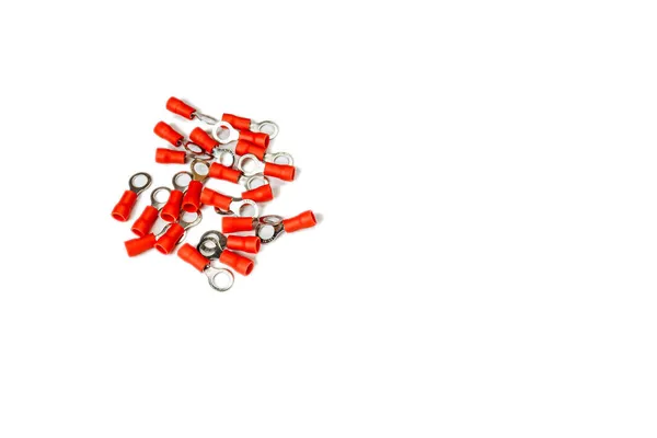 Connectors for electrical wires complete with insulated crimp terminals on a white background, isolate. Electrical shovel terminals, bullet butt connectors. Isolate