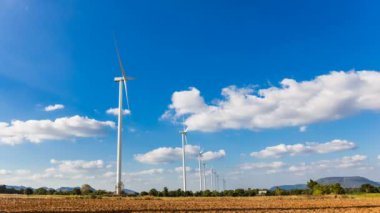 Time lapse of wind turbine for generating electricity from wind power with beautiful sky and clouds