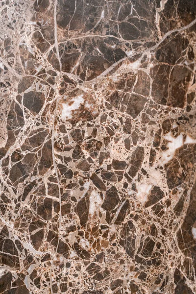 Luxuriöser dunkelbrauner Marmor mit hellen Schlieren. Der Hintergrund aus poliertem Quarzstein ist natürlich gestreift mit einem einzigartigen Muster, dunklen konzentrischen Streifen — Stockfoto