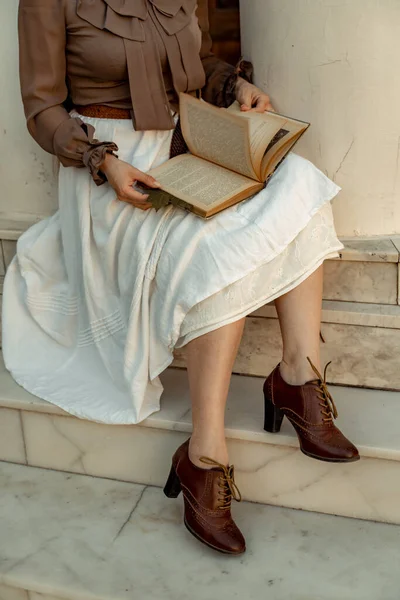 Woman White Skirt Brown Blouse Sits Holds Open Book Her — Stock Photo, Image