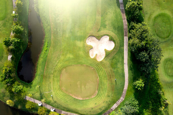 Aerial view Green Golf course in the morning.
