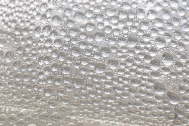 Dew droplets on nature background.