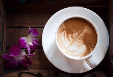 Latte Art Hot coffee in nature background.