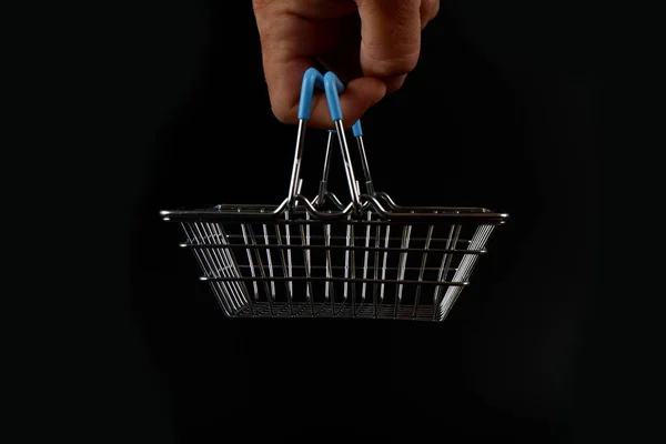 Small Shopping Basket Hangs Finger Black Background — Stock Photo, Image