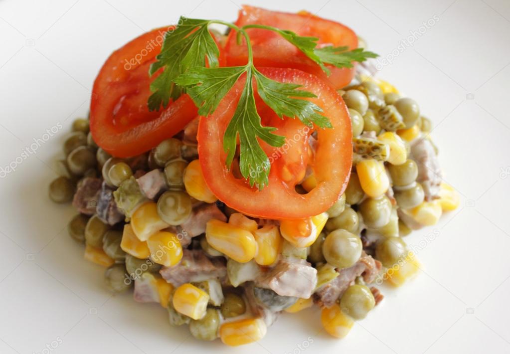Mayo beef salad with corn, peas and tomatoes.