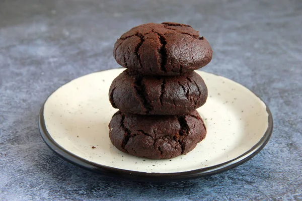 Homemade brownie cookies on the plate. Chocolate crack cookies on the plate. Sweet  cookies with dark chocolate.