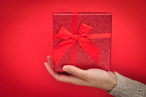 Red present box with bow. Gift for Christmas