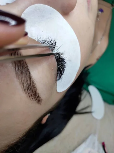 Lash extensions in beauty salon macro eye