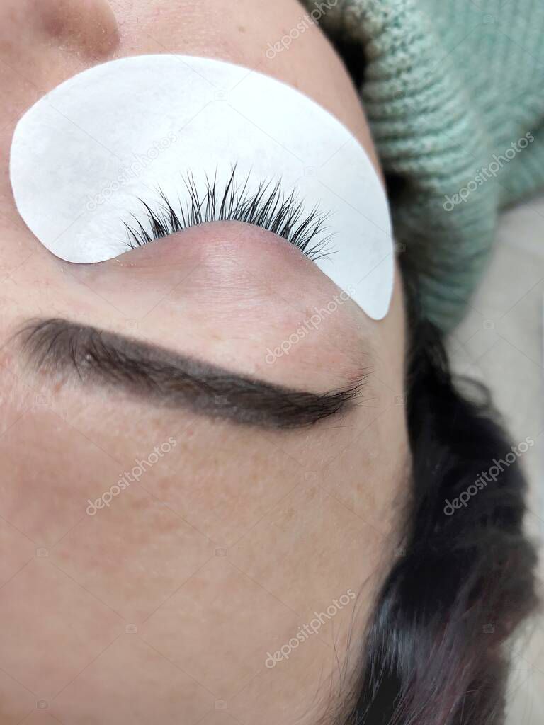 Lash extensions in beauty salon macro eye 