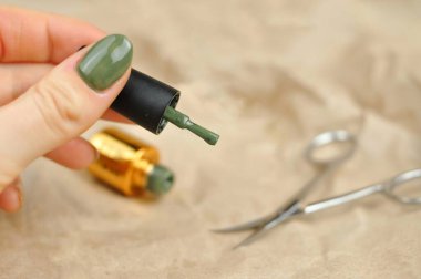 Green natural color of gel polish for manicure . High quality photo