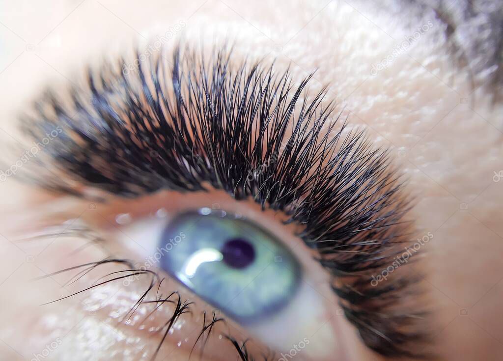 Lash extensions in beauty salon macro eye 