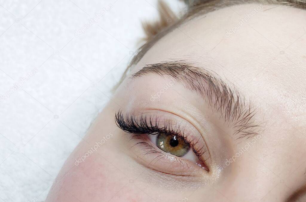 Eyelash extensions in beauty salon macro eye Kim effect 