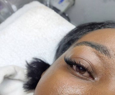 Eyelash extensions in beauty salon macro eye Kim effect 