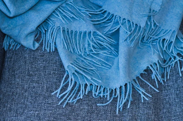 close up of blue blanket on the sofa in living room ,cozy home
