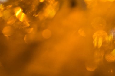 Altın bokeh odaklanmış arkaplan kopyalama alanı