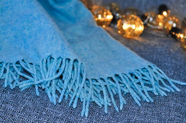 close up of blue blanket on the sofa in living room ,cozy home