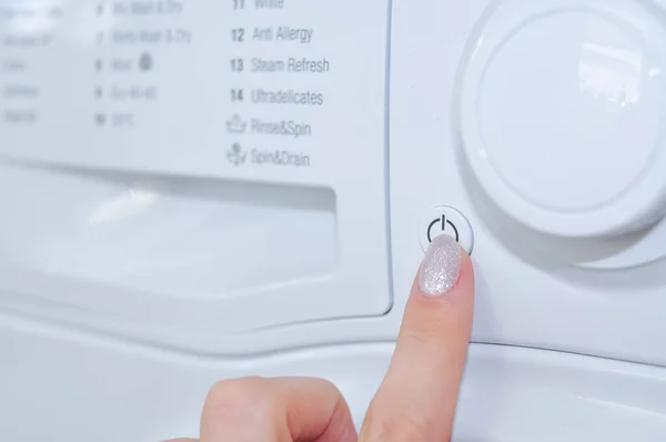 Close Womens Finger Pushing Button Washing Machine — Stock Photo, Image