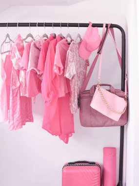 Pink woman's clothes in fitting room ,summer and spring look for girls. High quality photo