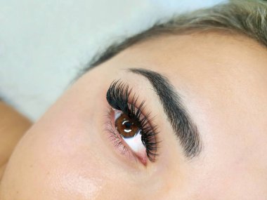 Close up of eyelash Extensions mega volume kim k wet effect . High quality photo