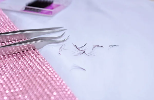 Bunches of fake lashes fell down after eyelash extensions, beauty salon problems. High quality photo