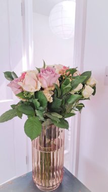 Close up of fresh pink,white and violet roses bouquet, gift for women . High quality photo